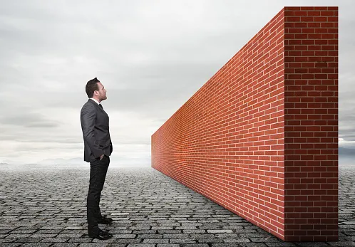 Man staring at a brick wall